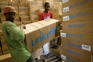 On 11 November, men load emergency medical supplies at a UNICEF warehouse in the port city of Gonaïves in Artibonite Region. The supplies, which bear the UNICEF logo, are for areas affected by the cholera outbreak. By 11 November 2010 in Haiti, the cholera outbreak that began in Artibonite Department had spread to four other departments, infected 9,123 people and killed 583. One case has also been confirmed and dozens more are suspected in Port-au-Prince, the capital where some 1.3 million people live in dense camps with inadequate sanitation facilities, making them highly vulnerable to a possible epidemic. Cholera is a deadly bacterial infection spread through contaminated food and water; children are the most vulnerable. The outbreak, which began on 21 October, is the countrys biggest medical crisis since the 12 January earthquake. Even before the quake, Haitis access to sanitation was among the worst in the world, a situation that is now greatly exacerbated by ruined infrastructure. Recovery operations made significant progress in providing safe water and sanitation to quake survivors, but communicable diseases remain a threat. Flooding and other damage caused by Hurricane Tomas, which hit the country late last week, further strains ongoing response efforts. The Government and other partners are establishing cholera treatment centres throughout the country and launching a public information campaign on cholera prevention. Haitis sanitation agency, DINEPA (Direction Nationale de l'Eau Potable et de l'Assainissement), is also distributing chlorine tablets and safe water, and is testing water sources for contamination. Working with the Government, UNICEF and partners are providing medical teams, distributing water purification chemicals, antibiotics, oral rehydration salts (ORS) and therapeutic foods to affected regions; as well as accelerating cholera prevention and treatment efforts in Port-au-Prince.