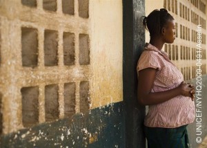 A girl, 15 years old and pregnant, leans against a wall in the city of Maburaka. She became pregnant while in secondary school. The father of the baby disappeared when he learned of her situation. Pregnancy is the third most common reason students drop out of primary school.  In March 2009 in Sierra Leone, children and adolescents continue to face barriers to protection and education. Infant mortality and under-five mortality rates remain the highest in the world, and nearly a third of the countrys children lack a primary caregiver. Girls are particularly vulnerable, contending with gender-based discrimination and harmful social practices, including child marriage and female genital mutilation/cutting (FGM/C). Some 56 per cent of girls marry before the age of 18, and 94 per cent of girls are subject to FGM/C, a procedure that can cause infection, chronic pain, complications during pregnancy and delivery, and increased rates of infant mortality. Education remains a hurdle for all children, with only half of all primary schools presently functioning. Dropout rates are high, particularly among girls, orphans, and children affected by poverty or sexual exploitation. UNICEF is responding to these conditions by working with Government officials and NGOs to rehabilitate schools and implement standards of care for all children. UNICEF is also working with community groups to promote girls education.