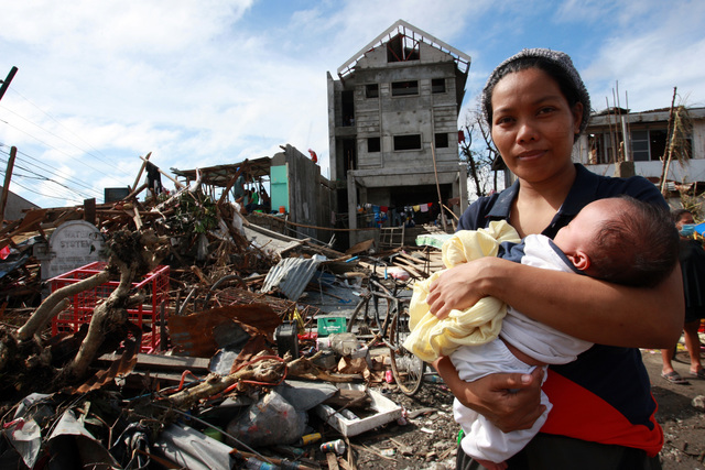 On 12 November, a woman cradling a baby stands amid deis and other destruction caused by Super Typhoon Haiyan, in Tacloban City the area worst affected by the disaster on the central island of Leyte. Water, sanitation and hygiene, food, medicine, shelter, deis clearance and communications are among the priority needs. Blocked roads have limited access and the delivery of relief supplies. On 12 November 2013 in the Philippines, Government-led emergency relief and recovery operations continue in the wake of the destruction caused by Super Typhoon Haiyan (known locally as Yolanda), which hit the central Philippines on 8 November. At least 2,500 people have been killed in the Category-5 storm; the death toll is expected to rise as more affected areas become accessible. Some 11.3 million people, including an estimated 4.7 million children, in nine regions across the country have been affected, and more than 673,000 people have been displaced. Most of them are sheltering in overcrowded evacuation centres. The storm, one of the most powerful ever recorded in the world, also destroyed homes, schools, hospitals, roads, communications and other basic infrastructure, and damaged power and water supply systems. As a result, access to the many areas remains limited, hampering humanitarian relief operations. In response to the emergency, UNICEF is rushing critical supplies to affected areas, including therapeutic food for children, health kits, and water and hygiene kits for up to 3,000 families. UNICEF is also airlifting US $1.3 million in additional relief supplies from its supply warehouse in Copenhagen for another 10,000 families, including those affected by the 7.2-magnitude earthquake that hit Bohol Province in mid-October. The shipments contain water purification tablets, soap, medical kits, tarpaulin sheets and micronutrient supplements. UNICEF is also supporting water and sanitation, education and child protection interventions for vulnerable children and
