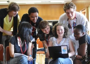 On 5 July, J8 youth delegates review their work on a laptop computer, at the Citizens' Cultural Centre in the city of Chitose on Hokkaido Island. They are: (left-right) Antoine Marie Oliver Bertrand-Hardy of France, Miho Kikuchi of Japan, Alexander Mario Wegner of Germany, Sergey Kononenko of the Russian Federation, Rose Elizabeth Stuart of the United Kingdom, Marco Zabai of Italy, and Nondumiso Thandeka Nkosi of South Africa.  From 2 to 9 July 2008 in Japan, 39 young people from around the world gathered in the city of Chitose on Hokkaido Island for the Junior 8 (J8) Summit, hosted by the Government of Japan and UNICEF. The meeting parallels the annual summit of Heads of State/Government from Group of 8 (G8) countries, also hosted on Hokkaido Island this year. G8 countries are Canada, France, Germany, Italy, Japan, the Russian Federation, the United Kingdom and the United States of America. The J8 Summit provides a platform for young people to discuss global issues, advocate for solutions and actions from world leaders and foster a global youth movement around international issues. Participants, aged 13 to 17, are from all of the G8 countries. Young people from seven developing countries, Barbados, Côte dIvoire, Iraq, Kyrgyzstan, Mongolia, Nepal and South Africa, also participated. The meeting focused on three principal G8 topics: climate change and global warming; poverty and development; and global health, particularly child survival and infectious diseases, including HIV/AIDS. On 7 July, J8 delegates, selected by their peers, presented their recommendations to G8 leaders at their meeting venue in the nearby town of Toyako. The recommendations asked that world leaders listen to young people and outlined specific proposals to reduce global warming (including the creation of Green Indexes to evaluate the climate-impact of products produced globally); reduce global poverty (including by supporting child rights and conflict resolution); and increase positive health initiatives worldwide (including education on disease prevention and G8 matching funds for developing country health sectors).