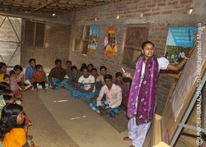20 December 2010: Salma,18, conducting a class at a Kishori Club session, where colleagues and other peer leaders discuss various social issue such as  early marriage and eve teasing in Paharpur Village, Nachol Upazila, Chapai Nawabganj. She refused early marriage, and as a peer leader she is going door to door to advocate social change in preventing early marriage.  Legally, the minimum age of marriage is 21 for boys and 18 for girls. However, 74 per cent of girls are married before the age of 18.  Over one third of girls are married before the age of 15. Although illegal, the practice of dowry  requiring a brides family to pay significant sums to the groom  encourages the marriage of the youngest adolescent girls because younger brides typically require smaller dowries. Dowry demands can continue after the wedding and sometimes result in violence against the bride when families are unable to pay. Early marriage also causes girls to drop out of education and limits their opportunities for social interaction. Only 45 per cent of adolescent girls are enrolled in secondary school and even fewer attend regularly.  New brides are expected to work in their husbands households and are subject to the same hazards as child domestic workers. In addition, early marriage leads to early pregnancy. One third of teenage girls aged 15 to 19 are mothers or are already pregnant.  Adolescent mothers are more likely to suffer from birthing complications than adult woman.
