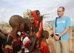 Christian Schneider, Executive Director, German National Committee chats with newly arrivals Somali refugees in the outskirts of Ifo refugee camp in north eastern Kenya, September 2, 2011. Photo by Antony Njuguna/UNICEF