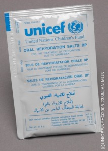A packet of oral rehydration salts (ORS), to treat dehydration caused by diarrhoea, is displayed at UNICEF's central supply warehouse in Copenhagen, the capital. The packet bears the UNICEF logo. The salts are a component of an emergency health kit. Designed to meet the initial primary health care needs of a displaced population without medical facilities, the kit contains basic drugs, medical supplies and equipment for 10,000 persons for 3 months, as well as basic sterilization equipment. The Copenhagen warehouse stocks components for 40 different kinds of kits, which are often used in emergencies. In 2005 in Denmark, UNICEF Supply Division Headquarters in Copenhagen, the capital, is the centre of UNICEF's global supply operations on behalf of children and families. Supply Division carries out the procurement, shipment and distribution of supplies for UNICEF-supported programmes, including bulk purchases, storage of standard kits and preparation of supplies and equipment for direct distribution to health centres, schools or other institutions in recipient countries. It also assists Governments and other United Nations agencies and development partners in procuring quality supplies. UNICEF Supply Division is also the largest purchaser of vaccines in the world. The Copenhagen warehouse is complemented by two strategic hubs (in Dubai and Panama), which together hold enough emergency supplies to meet the needs of 320,000 people for three weeks. The Division procured over US $1.1 billion in supplies in 2005 in response to an unprecedented number of natural disasters, food crises, conflicts and other humanitarian emergencies. The Copenhagen facility is also used by the Office of the United Nations High Commissioner for Refugees (UNHCR), the International Federation of the Red Cross and Red Crescent Societies (IFRC) and other organizations to stockpile emergency items.