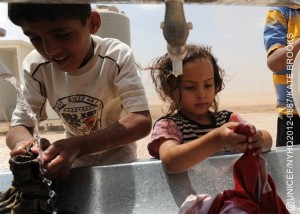 Children wash clothes, in Zaatari, a tented camp for Syrian refugees, on the outskirts of Mafraq, capital of the northern Mafraq Governorate. UNICEF assistance in the camp includes the provision of safe drinking water and the installation of permanent latrines, bathing facilities, wash basins, as well as mobile units containing these amenities. UNICEF also supports a child-friendly space, run by Save the Children. By late July 2012, Jordan was hosting 37,380 refugees from Syrias escalating war. Syrians have also fled to nearby Iraq, Lebanon and Turkey, inging the total number of refugees to over 120,000 half of them children. Inside Syria, an estimated 1.5 million people are in need of humanitarian assistance. Deaths, including of children and women, have surpassed 17,000. In Jordan, the number of refugees continues to increase, straining already limited resources in crowded accommodation facilities. Four transit sites in northern parts of the country are hosting nearly 5,200 refugees, though their intended capacity is less than half that. Zaatari, a UNICEF-assisted tented camp, has been newly built to accommodate over 100,000 refugees. UNICEF is working with diverse governments, the United Nations High Commission for Refugees (UNHCR) and local and international NGOs to respond to the needs of affected children in Jordan, other host countries and inside Syria. UNICEF also supports initiatives in education, water, sanitation and hygiene and child protection, including psychosocial assistance for children traumatized by their experiences in relation to the conflict. To fund this work, UNICEF has requested US$39.2 million, of which only 30 per cent has been received to date.