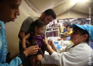 A health worker vaccinates a girl against measles, during the UNICEF-supported immunization campaign, in a mobile hospital in Zaatari, a tented camp for Syrian refugees. The camp, which presently hosts over 27,000 refugees, is located on the outskirts of Mafraq, capital of the northern Mafraq Governorate. By mid-September 2012, Jordan was hosting 86,940 refugees from Syrias escalating war. Syrians have also fled to nearby Iraq, Lebanon and Turkey, inging the total number of refugees to over 260,500. Inside Syria, some 2.5 million people have been affected by the conflict, of which 1.2 million half of them children are displaced. Deaths, including of children and women, have surpassed 18,000. In Jordan, the number of refugees continues to increase. On 11 September, UNICEF and the Ministry of Health, in coordination with the World Health Organization and other partners, launched a large-scale polio and measles vaccination campaign targeting over 100,000 children staying in the Zaatari refugee camp, nearby transit centres and in host communities. UNICEF continues working with diverse governments, other United Nations organizations and local and international NGOs to respond to the needs of affected children in all host countries and inside Syria. UNICEF also supports initiatives in education, water, sanitation and hygiene and child protection, including the provision of child-friendly spaces and psychosocial assistance for children traumatized by their experiences in relation to the conflict. To fund this work, UNICEF has requested US$65 million, of which only 38 per cent has been received to date.