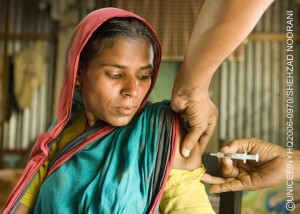 A woman is vaccinated against tetanus at a health outreach centre in the village of Kakail Chew in the eastern Ajmeriganj Subdistrict. The village is in the country's remote 'haor', or wetlands area, which is submerged under water for almost half the year. During the flooding period, villages become 'islands' and access to services is limited. In 2006, Bangladesh continues its decades-long trend toward reducing neonatal, infant and child mortality, and is on track to achieve Millennium Development Goals for both child and maternal mortality reduction. In the last two years, sanitation coverage has also increased, and the Government aims to achieve 100 per cent coverage by 2010. However, entrenched poverty and the lack of stable governance continue to threaten the lives of children. An estimated 30 million children live in poverty, lacking minimum access to health, education and basic social services, especially in remote, rural areas. Despite modest improvements in child stunting levels, the nutritional status of children and pregnant women remains inadequate. The problem of malnutrition begins at birth, with approximately one-third of infants born underweight. In addition, arsenic contamination in the groundwater remains affects 12 to 15 million people. UNICEF supports programmes to reduce infant and maternal mortality and improve the health and nutritional status of pregnant women. UNICEF also supports early childhood development and primary education, especially for girls; immunization and growth-monitoring programmes; and community-based water and sanitation initiatives.