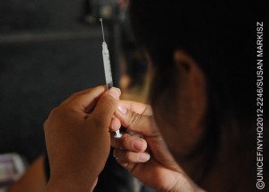 A health worker prepares a pentavalent vaccine at a health centre in the community of Corosal in Cobán Municipality, in Alta Verapaz Department. The pentavalent vaccine protects against five common diseases: diphtheria, tetanus, pertussis (whooping cough), hepatitis B and Haemophilus influenza type b (also called Hib, a cause of pneumonia and meningitis). The centre, which is open once a month, serves a population of 1,000, and is run by the Ministry of Health with support from UNICEF. Volunteer health workers provide routine health care and immunizations for pregnant women and children under 5 in five surrounding communities. [#2 IN SEQUENCE OF THREE] In November 2012 in Guatemala, the Government and other partners are continuing to assure sustained routine immunization of children  now reaching 92 per cent of all infants  against a range of vaccine-preventable diseases. The countrys last endemic case of measles was in 1997. In the entire Americas Region (covering North, Central and South America), the last endemic measles case was in 2002 and the last endemic case of rubella was in 2009  part of global efforts to eradicate these diseases. Worldwide, measles remains a leading cause of death among young children: In 2010, an estimated 139,300 people  mainly children under the age of 5  died from the disease. Nevertheless, these deaths decreased by 71 per cent from 2001 to 2011, thanks in part to the Measles & Rubella Initiative, a global partnership led by the American Red Cross, the United Nations Foundation, the United States Centers for Disease Control and Prevention (CDC), WHO and UNICEF. In Guatemala, despite this success, significant other challenges for children remain, much of it related to poverty levels that affect more than half of all children and adolescents. Poverty also contributes to chronic malnutrition affecting half of all under-5 children (with higher rates among indigenous populations); an average national education level of under six years of primary school (under three years for the rural poor); and high, though decreasing, rates of violence. Guatemala is also one of the worlds most vulnerable countries to climate change, suffering a major climate-related emergency every year since 2008. On the positive side, birth registration is improving, with more than 95 per cent of newborns now being registered. UNICEF is working with the Government and other partners to sustain achievements in health, address the high levels of malnutrition, strengthen responses to crimes against children and increase protection services for children throughout public services.