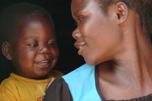 [RELEASE OBTAINED] Two-year-old Bright smiles at his aunt Leontina Chalikosa (formerly Mwewa), in Mulebambushi Village, Samfya District. Brights mother, Yvonne, died of AIDS the previous year, and Leontina is now his primary caretaker. PMTCT services were not available when Yvonne was pregnant with Bright, and she did not learn she was HIV-positive until after his birth. Bright became ill around the time his mother died; soon after, he tested positive for HIV. As part of paediatric services at the nearby Chimembe Clinic, Bright is receiving ARVs and his health has improved, though he is currently sick with malaria. [#1 IN SEQUENCE OF FIVE] In October 2010 in Zambia, clinics in both urban and rural areas are providing vital programmes to treat HIV-positive pregnant women and to prevent mother-to-child transmission of HIV (PMTCT). PMTCT programmes include HIV testing during pregnancy, antiretroviral (ARV) regimens for sick HIV-positive pregnant women, and early diagnosis and treatment for infants exposed to HIV in utero. These infants receive prophylactic antibiotics and ARVs in the weeks after they are born and are administered HIV tests at six weeks. If breastfed by an HIV-positive mother, infants continue to receive prophylactics and are tested again at 12 months and 18 months (and three months after breastfeeding ceases or at any age if they fall ill). HIV-positive infants diagnosed and treated within the first 12 weeks of life are 75 per cent less likely to die from the disease. However, many infants do not receive PMTCT services because their caregivers lack access to properly equipped facilities or fear the stigma associated with HIV. Zambia has recently made great strides in expanding PMTCT programmes. In the second quarter of 2009, ARVs were administered to approximately half of all children in need and to some 57 per cent of HIV-positive pregnant women. But for PMTCT measures to be effective, infants must adhere to a long-term, structured course of tests and services. Access to PMTCT services is particularly difficult in rural areas, where poverty rates are higher and many remote communities have limited access to health clinics. UNICEF supports the expansion of these services into rural areas, including Samfya District in Luapula Province. The province has the highest child-mortality rates in the country, and Samfyas clinics face critical staff and supply shortages. However, rural areas also tend to have lower HIV infection rates, as well as greater willingness on the part of fathers to participate in PMTCT services.
