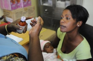 [RELEASE OBTAINED] Natasha Chisenga Simpasa, holding her six-week-old daughter, Mutale, listens as a health worker explains proper dosing of Mutales prophylactic antibiotics during a consultation at the Chelstone Clinic in Lusaka, the capital. Ms. Simpasa is HIV-positive. She participated in the clinics PMTCT programme for her sons, 20-month-old Fanwick and four-year-old Masonda, both of whom are HIV-negative. She is now participating in PMTCT for Mutale. Mutale has just received her first HIV test, but the results will not be known for several weeks. [#8 IN SEQUENCE OF NINE] In October 2010 in Zambia, the Chelstone Clinic in Lusaka continues to provide vital programmes to treat HIV-positive pregnant women and to prevent mother-to-child transmission of HIV (PMTCT). Some 95,000 Zambian children under age five are infected with HIV; the vast majority contracted the illness from an HIV-positive mother during pregnancy, delivery or breastfeeding. PMTCT programmes include HIV testing during pregnancy, antiretroviral (ARV) regimens for sick HIV-positive pregnant women, and early diagnosis and treatment for infants exposed to HIV in utero. Participating infants receive prophylactic antibiotics and ARVs in the weeks after they are born, and are administered HIV tests at six weeks. If breastfed by an HIV-positive mother, infants continue to receive prophylactics and are tested again at 12 months and 18 months (and three months after breastfeeding ceases or at any age if they fall ill). HIV-positive infants diagnosed and treated within the first 12 weeks of life are 75 per cent less likely to die from the disease. Zambia has recently made great strides in expanding PMTCT programmes. In the second quarter of 2009, ARVs were administered to approximately half of all children in need and to some 57 per cent of HIV-positive pregnant women. However, many infants still do not receive PMTCT services because their caretakers lack access to properly equipped facilities, or fear the stigma associated with HIV, or find it difficult to adhere to the structured course of required tests and services.