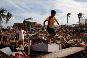 Children walk amid the damage caused by Typhoon Haiyan (local name Yolanda) in the city of Tacloban, Leyte, Philippines. An estimated 2.8 million preschool and school aged children may have been driven from their homes. On 10 November 2013 in the Philippines, Government-led emergency relief operations continue in the wake of the destruction caused by Super Typhoon Haiyan (known locally as Yolanda), which hit the central Philippines on 8 November. At least 1,200 people have been killed in the Category-5 storm; the death toll is expected to rise as more affected areas become accessible. Some 9.5 million people in nine regions across the country have been affected, and an estimated 618,175 people have been displaced. Most of them are sheltering in overcrowded evacuation centres. The storm, one of the most powerful ever recorded in the world, also destroyed homes, schools, roads, communications and basic infrastructure, and damaged water supply systems. As a result, access to the worst affected areas remains limited, hampering humanitarian relief operations. In response to the emergency, UNICEF is rushing critical supplies to affected areas, including therapeutic food for children, health kits, and water and hygiene kits for up to 3,000 families. UNICEF is also airlifting US $1.3 million in additional relief supplies from its supply warehouse in Copenhagen for another 10,000 families, including those affected by the 7.2-magnitude earthquake that hit Bohol Province in mid-October. The shipments contain water purification tablets, soap, medical kits, tarpaulin sheets and micronutrient supplements. UNICEF is also supporting water and sanitation, education and child protection interventions for vulnerable children and families.