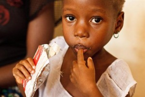 Four-year-old Mame Koroma, who is malnourished, consumes a ready-to-eat therapeutic food at the Kailahun Government Hospital in Kailahun, a town in Kailahun District. In March 2011 in Sierra Leone, the country commemorated the ten year anniversary of the end of its civil war, which left 50,000 dead and 10,000 amputated. Although progress has been made since the wars end, Sierra Leone still ranks at the bottom of the 2010 Human Development Index. Health centres remain under-resourced, and medical care remains too expensive and inaccessible for many people. The countrys under-five mortality rate is fifth highest in the world, maternal mortality is among the worlds worst as well, and over a third of children under age five suffer stunting due to poor nutrition. According to 2008 data, only 49 per cent of the population uses improved drinking water sources, and only 13 per cent have access to improved sanitation facilities. Education systems are also deficient, with an insufficient number of schools and trained teachers. Girls face additional barriers to education, including high rates of early marriage and teen pregnancy, extra fees, and sexual abuse and exploitation in schools. UNICEF is working with the Government and partners to improve conditions for Sierra Leones children, supporting programmes that train teachers and school managers and that strengthen community-based health systems. UNICEF also supports a Government programme, launched in April 2010, that abolishes fees for primary health services for pregnant and lactating women and all children under age five.