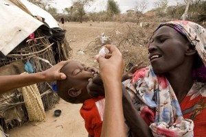 A child under the age of five gets immunised against Polio, Measles and worms on a house-to-house programme run by UNICEF in the town of Dadaab in northeastern Kenya on July 28, 2011.