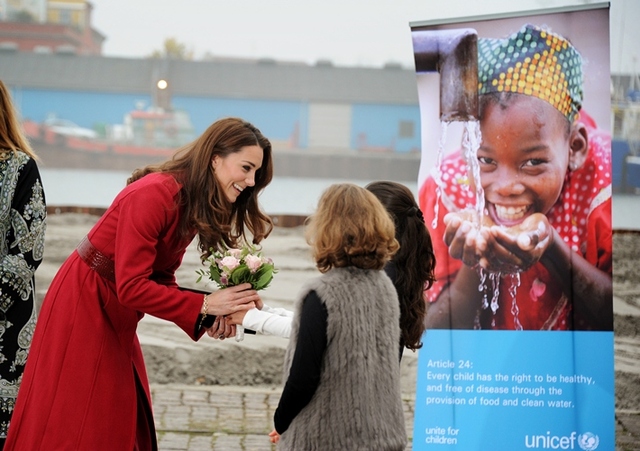 The Duchess of Cambridge (L) receives flowers from two local girls on her arrival at UNICEF's  Supply Division, Copenhagen. 

2. November 2011, UNICEF Supply Division, Copenhagen
 
The Duke and Duchess of Cambridge (William and Catherine) accompanied by the Crown Prince and Crown Princess of Denmark (Frederik and Mary) made a special visit to the UNICEF global supply centre in Copenhagen to help maintain the world’s attention on the humanitarian crisis in East Africa, which has left more than 320,000 children so severely malnourished that they are at imminent risk of death unless they get urgent help.
 
UNICEF’s supply centre includes a warehouse the size of three football pitches where essential supplies for children around the globe are sourced, packed and distributed. These include food, water, special nutritional supplies for the most malnourished children, vaccines, education materials and emergency medical kits.
 
Whilst at the supply centre both couples were briefed on the desperate situation in the region by UNICEF specialists. The royal couples then joined UNICEF warehouse staff on packing line, and helped to pack emergency health kits, ready to be sent to East Africa. Each kit will provide life-saving supplies to over 1000 people.
 
The Duke and Duchess and the Crown Prince and Princess then toured the warehouse, seeing the huge variety of supplies that are sent to emergencies around the world, including ready-to-use therapeutic food for severely malnourished children under five years old and supplementary food to support-families, emergency health kits, vaccines and water supplies including water purification tablets.
 
At the end of their visit the Duke of Cambridge said “An incredible amount is being done. UNICEF is leading the way and doing a fantastic job, but sadly there’s lots more still to do, and that’s why we’re here today”
 
To donate to UNICEF East Africa Appeal please visit www.eastafricacrisis.org
