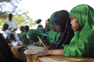 Girls attend a class in Horyal Primary School in the Ifo refugee camp in North Eastern Province, near the Kenya-Somalia border. The class is being held outdoors due to a lack of indoor space. The camp is among three that comprise the Dadaab camps, located near the town of Dadaab in Garissa District.  On 10 July 2011 in eastern Kenya, UNICEF Regional Director for Eastern and Southern Africa Elhadj As Sy visited the Dadaab camp for Somali refugees to focus increased attention on the humanitarian crisis in the Horn of Africa. Kenya, Somalia and Ethiopia are the three Horn of Africa countries most affected by a deepening drought, rising food prices and the persistent conflict in Somalia. More than 10 million people, including in neighbouring Djibouti and Uganda, are now threatened by the worst drought in the region in 60 years. Somalia faces one of the most-severe food security crises in the world as it continues to endure an extended humanitarian emergency, with tens of thousands fleeing into Kenya and Ethiopia. More than 10,000 Somalis a week are arriving in the Dadaab camps, where aid partners struggle to meet the needs of some 360,000 people, in facilities meant for 90,000. In northern Kenya, more than 25 per cent of children suffer from global acute malnutrition  in the Turkana district the rate is at 37.4 per cent, its highest ever. An estimated 480,000 severely malnourished children are at risk of dying in drought-affected areas of Kenya, Somalia, Ethiopia and Djibouti; while a further 1.6 million moderately malnourished children and the wider-affected population are at high risk of disease. UNICEF, together with Governments, UN, NGO and community partners, is supporting a range of interventions and essential services, especially for the displaced and for refugees, including feeding programmes, immunization campaigns, health outreach, and access to safe water and to improve sanitation. UNICEF is seeking US $31.8 million for the next three months to provide humanitarian assistance for children and women in the four most-affected countries.