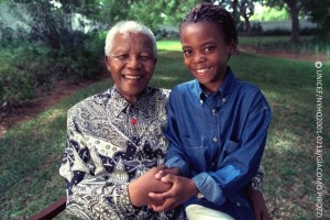 (Left-right) South African Kamo Masilo, a 12-year-old boy, and former President of South Africa Nelson Mandela join hands in Maputo, the capital, having each made their individual pledge in support of 'Say Yes' at the campaign's web site. Kamo recently participated with Mr. Mandela in the filming of a television public service announcement (PSA) to help launch the Global Movement for Children.  On 21 April 2001 in Mozambique, Nobel Peace Prize laureate and former President of South Africa Nelson Mandela and Mozambican child rights advocate Graca Machel joined 12-year-old South African Kamo Masilo to 'Say Yes for Children', an unprecedented global sign-up campaign in support of 10 overarching imperatives to improve and protect the lives of children. These are: Leave No Child Out; Put Children First; Care for Every Child; Fight HIV/AIDS; Stop Harming and Exploiting Children; Listen to Children; Educate Every Child; Protect Children from War; Protect the Earth for Children; and Fight Poverty: Invest in Children. Launching internationally on 26 April in London, the United Kingdom, 'Say Yes for Children' promises to gather millions of pledges through a worldwide outreach, from hamlets to urban centres, on paper and via the Internet. These pledges will be tallied through September of this year and presented to Heads of State and Government at the United Nations Special Session on Children, to be held 19-21 September at United Nations Headquarters. The campaign is the first major initiative of the Global Movement for Children (GMC), a coalition of some of the world's largest child rights organizations in a unique partnership to raise awareness about issues affecting children. Since Mr. Mandela and Ms. Machel launched the leadership initiative in support of the GMC in May 2000, other world leaders, celebrities and notables -- including United Nations Secretary-General Kofi Annan and prominent US businessman and philanthropist Bill Gates -- are also playing key roles in the 'Say Yes for Children' campaign. The 'Say Yes' pledge form and additional information can be found at: www.gmfc.org.