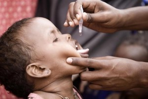On 29 July, a child receives a dose of oral polio vaccine during the UNICEF-supported measles and polio immunization campaign under way in the Ifo refugee camp in North Eastern Province, near the Kenya-Somalia border. The camp for Somalia refugees is among three that comprise the Dadaab camps, located near the town of Dadaab in Garissa District. By 2 August 2011, the crisis in the Horn of Africa affecting primarily Kenya, Somalia, Ethiopia and Djibouti continues, with a worsening drought, rising food prices and an ongoing conflict in Somalia. More than 12 million people are threatened by the regions worst drought in 60 years. Somalia faces one of the worlds most severe food security crises as it continues to endure an extended humanitarian emergency, with tens of thousands fleeing into Kenya and Ethiopia. More than 10,000 Somalis a week are now arriving in the Dadaab camps in north-eastern Kenya, where aid partners are struggling to meet the needs of 400,000 people. In drought-affected areas of Kenya, Somalia, Ethiopia and Djibouti, some 500,000 severely malnourished children are at imminent risk of dying, while a further 1.6 million moderately malnourished children and the wider-affected population are at high risk of disease. In northern Kenya, more than 25 per cent of children suffer from global acute malnutrition. UNICEF, together with Governments, UN, NGO and community partners, is supporting a range of interventions and essential services, especially for the displaced and for refugees, including feeding programmes, immunization mass vaccination campaigns are now underway in drought-affected parts of Kenya and Somalia and other health outreach, as well as access to safe water and to improve sanitation. In Kenya, the Ministry of Health, UNICEF and the World Health Organization (WHO) have reached 290,000 children with polio and measles vaccinations in refugee host communities near the Dadaab camps. UNICEF is providing the vaccines, as well as deworming tablets and vitamin A (to boost childrens immunity). A similar campaign is now under way to immunize children in the Dadaab camps. A joint United Nations appeal for humanitarian assistance for the region requires US$2.5 billion, less than half of which has been committed.