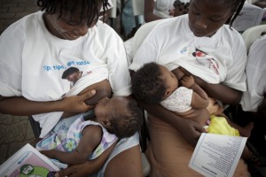 Two women breastfeed their infants during a ceremony to commemorate the beginning of World Breastfeeding Week 2011, in the UNICEF-supported maternity ward at Isaie Jeanty Hospital in Port-au-Prince, the capital. The Week  a joint initiative of UNICEF, the World Health Organization (WHO), the World Alliance for Breastfeeding Action (WABA) and other NGOs  promotes breastfeeding, the most cost-effective preventive intervention to reduce under-five mortality. In December 2011, Haiti and its approximately 4.3 million children continue to recover from the 12 January 2010 earthquake that killed some 220,000 people, displaced more than 1.6 million and further disrupted the countrys already inadequate infrastructure. Progress has been substantial: a new national government is in place; about half of the mounds of rubble have been cleared; almost two thirds of those displaced by the quake have moved out of crowded camps; and the countrys health, education and other core services are being rebuilt on a stronger foundation. Still, the country remains a fragile and impoverished state, requiring international support. Working with multiple international and national partners, UNICEF continues to address the emergency needs of children, while focusing on building the Governments capacity to uphold and sustain childrens rights. In nutrition, an unprecedented expansion of preventive and treatment services for childhood under-nutrition has begun to address the pre-quake silent crisis of chronic malnutrition. In health, routine child immunizations increased to almost 80 per cent in the past year; medicines and training for midwives have increased; HIV prevention and treatment services, including to prevent mother-to-child transmission (PMTCT) of the virus, are expanding; and a national emergency cholera treatment response was implemented (in response to the late 2010 cholera outbreak). Emergency WASH (water, sanitation and hygiene) services, including for ch