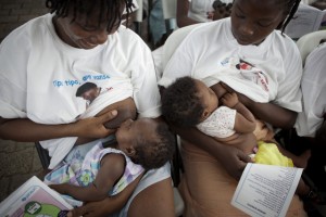 Two women breastfeed their infants during a ceremony to commemorate the beginning of World Breastfeeding Week 2011, in the UNICEF-supported maternity ward at Isaie Jeanty Hospital in Port-au-Prince, the capital. The Week  a joint initiative of UNICEF, the World Health Organization (WHO), the World Alliance for Breastfeeding Action (WABA) and other NGOs  promotes breastfeeding, the most cost-effective preventive intervention to reduce under-five mortality. In December 2011, Haiti and its approximately 4.3 million children continue to recover from the 12 January 2010 earthquake that killed some 220,000 people, displaced more than 1.6 million and further disrupted the countrys already inadequate infrastructure. Progress has been substantial: a new national government is in place; about half of the mounds of rubble have been cleared; almost two thirds of those displaced by the quake have moved out of crowded camps; and the countrys health, education and other core services are being rebuilt on a stronger foundation. Still, the country remains a fragile and impoverished state, requiring international support. Working with multiple international and national partners, UNICEF continues to address the emergency needs of children, while focusing on building the Governments capacity to uphold and sustain childrens rights. In nutrition, an unprecedented expansion of preventive and treatment services for childhood under-nutrition has begun to address the pre-quake silent crisis of chronic malnutrition. In health, routine child immunizations increased to almost 80 per cent in the past year; medicines and training for midwives have increased; HIV prevention and treatment services, including to prevent mother-to-child transmission (PMTCT) of the virus, are expanding; and a national emergency cholera treatment response was implemented (in response to the late 2010 cholera outeak). Emergency WASH (water, sanitation and hygiene) services, including for ch