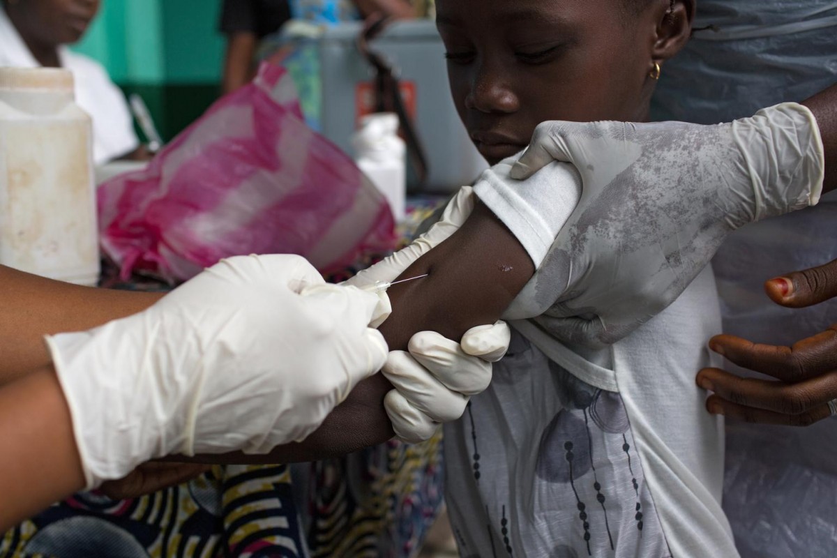 A child receives a measles vaccination at the Madina Health Centre in Guéckédou, Guinea, 23 April 2015.

For the first time since the start of the Ebola outbreak, Guinea, Liberia and Sierra Leone are conducting major nationwide immunization campaigns to protect millions of children against preventable but potentially deadly diseases. As World Immunization Week is marked from April 24 to 30, the three countries most affected by Ebola aim to vaccinate more than three million children against diseases such as measles and polio in UNICEF-supported campaigns that involve the provision of vaccines and the training and deployment of thousands of immunization teams. As the immunization campaigns are taking place while the threat of Ebola remains, vaccinators are following strict protocols including the use of protective wear, such as gloves and aprons, as well as regular handwashing. More than 26,000 cases of Ebola and 10,000 deaths have been reported across the three countries where the outbreak has weakened already fragile health systems while disrupting routine health interventions.