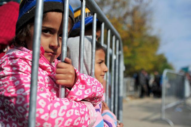 On 28 October 2015 in Serbia, two children are waiting their parents to finalize the registration procedure in the Reception Centre in the town of Presevo, close to the border with the former Yugoslav Republic of Macedonia. In 2015, refugee and migrants continue to move to Europe at levels not seen since World War II, with children comprising a quarter of all asylum seekers in Europe so far this year. As of 27 October, since the beginning of 2015, the number of people registering their intent to seek asylum in the Republic of Serbia has reached 301,957. Around 25% are children. The One Stop Registration centre in Presevo is operating 24/7 and has increased its registration capacity to almost 8,000 people per day. Most refugees and migrants leave the same day and continue their journey by bus directly to the border with Croatia in Sid, aiming to reach western or northern European countries. Three UNICEF child friendly spaces, equipped with educational materials and toys, are currently operating in Preevo (near the border with the former Yugoslav Republic of Macedonia), Belgrade, and id. Over 4,300 children, most of whom between 6 and 10 years old, have so far rested and played in these safe spaces. The spaces have educational materials and toys for the children who are passing through the area, exhausted from their long journeys. Most of the children have experienced some kind of trauma, so the child-friendly spaces are safe havens for them  places where they can rest for a while and feel like children again.