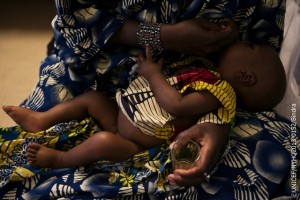 On 13 March, Aissatou Soumaiga breastfeeds 8-month-old Amadou Harouna in the hospital in the conflict-affected city of Gao, capital of the north-eastern Gao Region. Amadou is being treated for severe malnutrition and resulting kwashiorkor, which is characterized by oedema and a loss of appetite.  In mid-March 2013 in Mali, renewed insecurity in central and northern parts of the country continues to exacerbate existing humanitarian needs. An estimated 270,765 people are displaced, while 176,777 continue to seek refuge in neighbouring countries. Additionally, Mali remains one of eight countries in the Sahel region  also including Burkina Faso, Chad, Mauritania, Niger and the northern parts of Cameroon, Nigeria and Senegal  facing a severe food and nutrition crisis. The emergency is the result of repeated drought-related food shortages, from which people have had insufficient time to recover before being again affected. Conditions have improved since the height of the crisis in early 2012. Still, an estimated 10.3 million people throughout the Sahel remain food insecure. In Mali, the pairing of food shortages with conflict has left children increasingly vulnerable: 210,000 children under age 5 are at risk of severe acute malnutrition, and 450,000 are at risk of moderate acute malnutrition. Limited access to basic services, including water, sanitation and hygiene, is another key concern. Additionally, some 200,000 children from conflict-affected areas are at risk of injury or death due to explosive remnants of war. Despite the reopening of some schools, access to education remains severely constricted. To respond to these and other needs throughout the year, UNICEF, together with multiple humanitarian partners, including other United Nations agencies as well as NGOs, have called for over US$370 million in the 2013 Consolidated Appeal for Mali. (UNICEFs portion of the Appeal is approximately US$84.7 million.) Only 15 per cent of the Appeal has been funded to date.