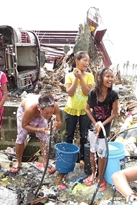 Children bathe and wash their clothes as the first water treatment plant in Tacloban came back to full operating capacity, restoring water supply in 80 per cent of the city and benefiting around 200,000 people. "I think for some of these children it may have been the first time they have been laughing and playing since Haiyan struck. Having enough water to keep clean not only helps prevent the spread of disease, but it also has a positive impact on everyone's mood  everyone feels better when they are clean!" says Dr. Mike Gnilo, UNICEF Philippines Water, Sanitation & Hygiene (WASH) Specialist.
