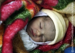 An infant sleeps under a blanket in a baby-friendly hospital in the port city of Latakia in the western Latakia Governorate. The Baby-Friendly Hospital Initiative (BFHI), a global campaign led by the World Health Organization and UNICEF and endorsed by world leaders and health experts, encourages hospitals and health workers to support mothers' efforts to breastfeed. In April 2006, the Syrian Arab Republic has made considerable progress towards improving the situation of children and women and is on track to achieve almost all Millennium Development Goals. The country has high immunization coverage rates; infant, under-five and maternal mortality rates have declined; overall primary-school enrolment rates are above 90 per cent; and HIV/AIDS prevalence is low. Nevertheless challenges remain, including for refugees, children with disabilities and children in conflict with the law. Due to long working hours, tens of thousands of children nationwide are not in school. Gender and geographic disparities persist, including in education, and are wider in the five northern and north-eastern governorates, home to half of Syria's 18.6 million inhabitants. Political instability in the region, high unemployment and other economic factors also affect the country's overall development. UNICEF supports health, education, water and sanitation and child protection initiatives, HIV/AIDS awareness and prevention programmes for adolescents and young people, and educational projects for children with special needs. UNICEF is also supporting policy and legislative initiatives to protect and promote children's rights.