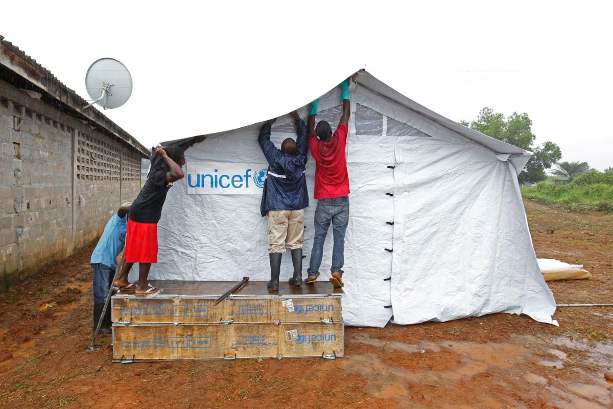 On 2 July 2015 heavy rains did not stop the team from working to construct UNICEF tents as part of the Ebola response in Liberia in Unification Town, Margibi County, Liberia.

In Margibi County, where the body of a child tested positive for the virus on 29 June, UNICEF social mobilization teams are on the ground conducting door-to-door awareness campaigns on Ebola prevention, to minimize the risk of further infections and to protect and assist those affected. Responding to Liberias first confirmed cases of Ebola in more than three months, UNICEF has begun distributing emergency supplies in the affected communities including tents for isolating those under quarantine, hygiene kits and chlorine and buckets for handwashing stations.