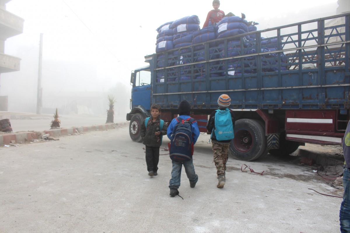 On 24 February, children approach a truck carrying humanitarian aid for Moadamiyeh, part of an overnight mission to the besieged town. In total, UNICEF delivered sixteen truckloads of winter clothing and diapers.

Building on the five UN inter-agency convoys the previous week, UNICEF and its partners have delivered to over 100,000 people in besieged communities in February this year. However, over 4.6 million people  over two million of them children - live in hard-to-reach locations across the country, including more than 486,000 in besieged locations like Moadamiyeh and Kafr Batna. As the deadline for a national cessation of hostilities nears this Saturday, UNICEF and all partners are urgently calling for unimpeded, unconditional and sustained access to all 13.5 million people in need across the country.