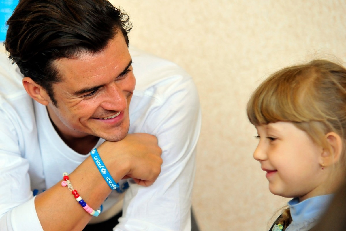 On 27 April 2016, (left) UNICEF Goodwill Ambassador Orlando Bloom plays lego with pupils of School #13 in Slovyansk, as part of a visit to conflict-hit eastern Ukraine. He was in the country to raise awareness of the global education crisis facing children in emergencies.

UNICEF Goodwill Ambassador Orlando Bloom visits School #13 in Slovyansk as part of a visit to conflict-hit eastern Ukraine to raise awareness of the global education crisis facing children in emergencies.  School #13 was one of the first hit by shelling in the conflict that broke out more than 2 years ago.  It is one of the 57 schools that UNICEF has helped to repair and refurbish in the region. UNICEF provided new school furniture, lego for classrooms, games and trained the school psychologist to help children cope with their experiences.   Across the conflict area, approximately 580,000 children are in urgent need of aid and more than 230,000 children have been forced from their homes. Around one in five schools and kindergartens in the region have been damaged or destroyed and around 300,000 children are in immediate need of assistance to continue their education.  The trip came as new findings show that nearly a quarter of the world's school-aged children - 462 million - now live in countries affected by crisis.

The Education Cannot Wait Proposal, written by the Overseas Development Institute and commissioned by a range of partners including UNICEF, reveals that nearly than one in six  or 75 million  children from pre-primary to upper-secondary age (3-18) living in nations affected by crises is classed as being in desperate need of educational support.  However, on average, only two per cent of global humanitarian appeals is dedicated to education.  At the very first World Humanitarian Summit in Istanbul in less than three weeks time, a  groundbreaking new fund - Education Cannot Wait  - will be launched to give access to learning to  every child in need in emergencies. It aims to ra