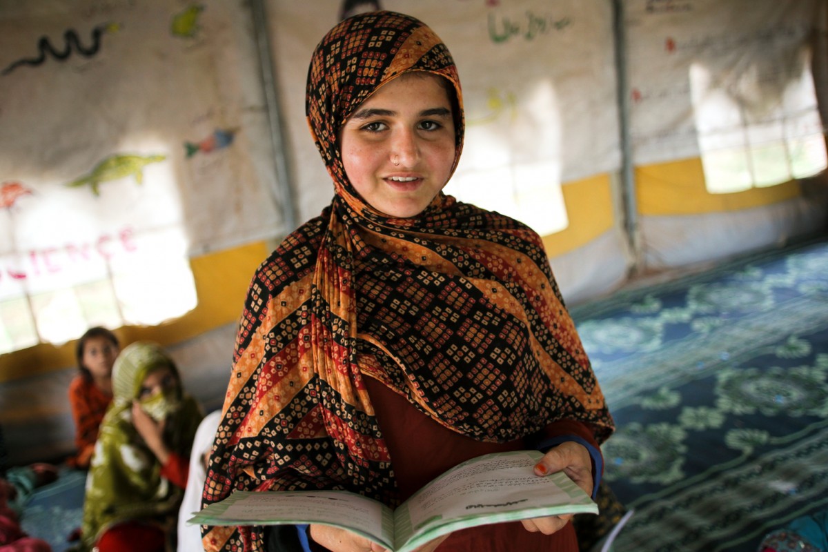 Zainab Jan (12) is a grade 4 student at one of the UNICEF-supported camp schools in the Jalozai camp for Internally Displaced Persons (IDPs) in Nowshera district, Khyber Pakhtunkhwa. Along with her family, she has been living in the camp since 2009, due to insecurity in Khyber Agency in the Federally Administered Tribal Areas of Pakistan.UNICEF has established 30 schools in Jalozai camp, Nowshera district of Khyber Pakhtunkhwar (KP) province of Pakistan for children of families which have been displaced from various areas in KP and the Federally Administered Tribal Areas (FATA) due to insecurity. Twenty of these camp school are benefitting from the Nobel Peace Prize funds under the "Access to Education for Children Affected by Insecurity" programme of the European Union through the European Commission's Humanitarian Aid department (ECHO).