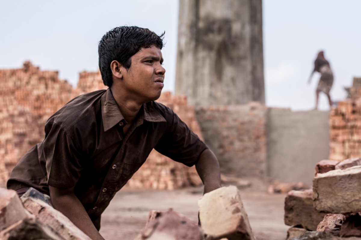 Arieful Islam, 13, works in a brick field in Assasuni sub-district in Bangladesh on April 2, 2016. Arieful dropped out of school in first grade and has never had the chance to consider what he wants to be when he grows up. At just 13 years old, Arieful has been working for longer than he can remember. He started in the fisheries when he was in the first grade, and then later began an apprenticeship in the brickworksunpaid labor that typically comes with a meal. Today, he is a regular laborer at a brick factory where he works alongside much of his family, earning about 230 Taka (USD$3) a day. During the off-season, his mother borrows money from the factory owner just to make it through the rest of the year. The entire family works to pay back the loan the following season. Arieful is now enrolled in a second chance education programme that runs in the evening. The programme is supported by UNICEF and aims to give children who were forced to drop out of school another chance at an education, and school hours are planned for after the children finish work. The programme provides a small stipend, but its not enough to compensate for the money he earns as a brick worker. During brick season, when work is busy, his attendance is irregular. 
For children and adolescents, poverty is about more than money. They experience it in the form of deprivations that affect multiple aspects of their lives  including their chances of attending school, being well nourished and having access to health care, safe drinking water and sanitation. Taken together, these deprivations effectively cut childhood short, robbing millions of children of the very things that define what it is to be a child: play, laughter, growth and learning. These basic opportunities are the foundation upon which children can build their futures  and for those who have a chance to enjoy them, the world can seem full of possibilities. But for a child who is out of school because he needs to work jus