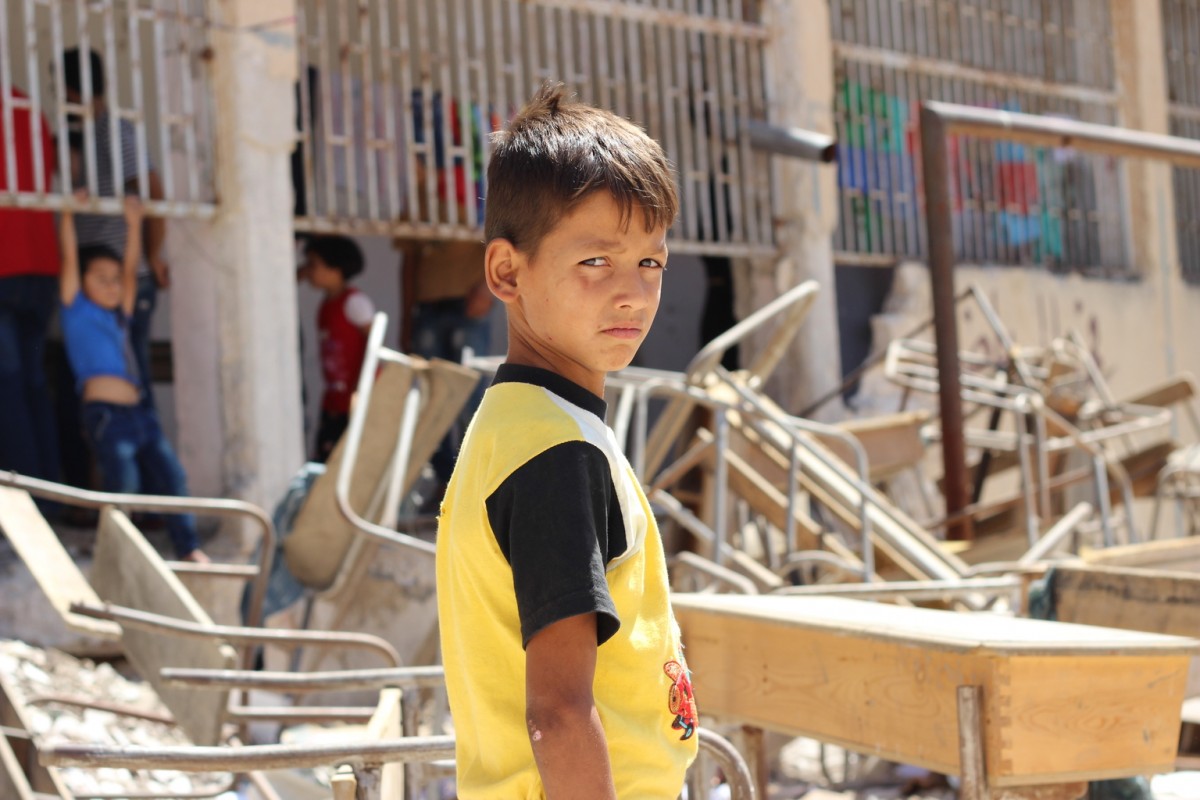 On 10 August 2016 in the Syrian Arab Republic, a displaced child from al-Hamadaniyah neighbourhood in the western part of Aleppo, now stays at a school turned into a shelter. 

By end August 2016, children continue to bear the brunt of the latest surge in violence in Aleppo.  In the eastern part of Aleppo, around 100,000 children remain trapped since early July.  Water has ceased flowing through the public network, as the generator that operates the main water pumping station needs urgent repairs.  UNICEF does not have safe access to provide the urgent humanitarian assistance needed in the area.

In the western part of Aleppo, an estimated 35,000 people were displaced when new waves of fighting hit the al-Hamadaniyah neighbourhood.  Already displaced by the war and living in half-built apartment towers, again families had to flee and leave everything behind.  Most families are currently staying in informal shelters such as schools and mosques as well as in parks and on the streets.  UNICEF trucks in water daily for 300,000 of the most vulnerable people including newly displaced families in informal shelters. The main electricity network that powers pumping stations sustained damage in recent fighting. UNICEF supports the delivery of fuel to operate generators for water pumping stations and groundwater wells that provide safe drinking water to around 1.2 million people.
