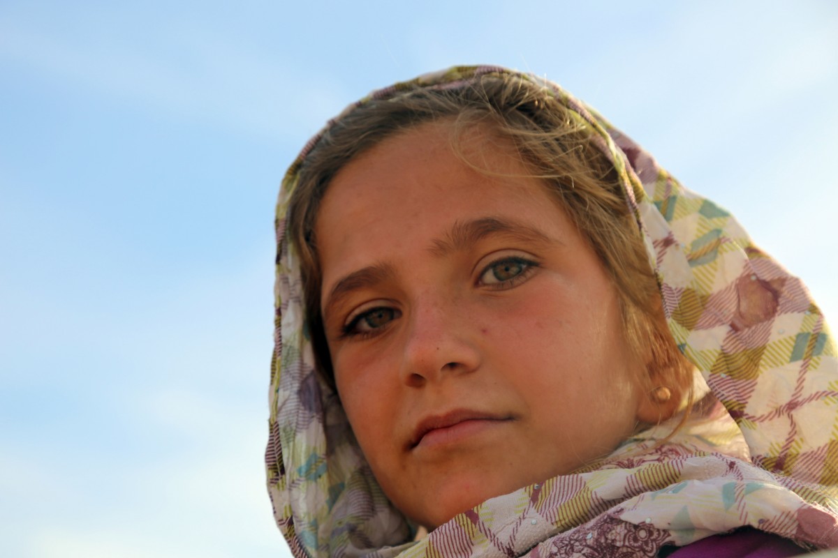 On 9 November 2016, a young girl is seen on her way to Ain Issa, escaping violence in the Al- Hisha village in rural Raqqa. Some carried mattresses and blankets, while others brought their livestock, including goats, cows and sheep. Ain Issa is the main staging point for displaced families, some 50 Km north of Raqqa city.

As at 15 November 2016 in the Syrian Arab Republic, almost 7,000 people fled their homes in villages around rural Raqqa to Ain Issa, the main staging point for displaced families, some 50 kilometres north of Raqqa city, as reported military operations on ISIL controlled Raqqa city scale up. Children in Raqqa have suffered immensely over the past three years and access to the area has been highly constrained due to insecurity and restrictions on the delivery of humanitarian assistance. The last UN inter-agency aid convoy to Raqqa was in October 2013. UNICEF and partners estimate that around 175,000 children could be affected by the violence.  While the situation in the Raqqa area continues to evolve, UNICEF is pre-positioning supplies in various locations to provide critical support for displaced children and their families, including preparing a package of items to provide winter clothing and thermal blankets, as well as critical hygiene and medical kits. Micronutrients, therapeutic food and vaccinations to improve the nutritional and health status of these children will also be available. While water trucking, network repairs and chlorination will provide safe water and reduce the likelihood of waterborne diseases. Materials to support psychosocial activities, as well as recreational and educational kits will also be provided to help children restart their learning and resume some normality in life.