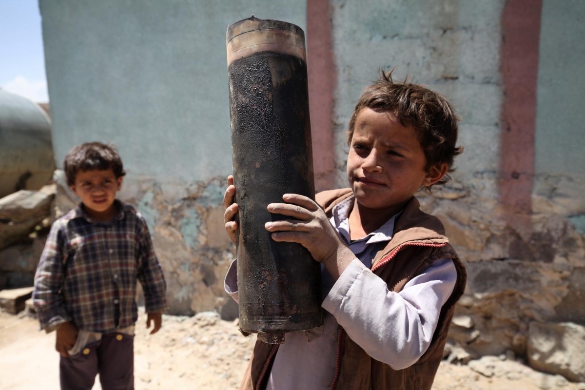 On 23 April, a boy holds a large piece of exploded artillery shell, which landed in the area during a blast, in the village of Al Mahjar, a suburb of Sanaa, the capital. Another boy stands nearby.

By 12 May 2015 in Yemen, escalating conflict continued to exact a heavy toll on children and their families. Some 300,000 people have been internally displaced. Casualties have reached 1,527, including 115 children, and 6,266 people have been injured, including 172 children. Prior to the current crisis, 15.9 million people  including 7.9 million children  were already in need of humanitarian assistance. Despite the challenging operating conditions, UNICEF is scaling up its humanitarian response, including in the areas of nutrition, water, sanitation and hygiene (WASH), health, child protection and education. Support since the start of the current conflict has included providing access to clean water to 604,360 people and access to antenatal, delivery and postnatal care to 3,386 pregnant women; distributing hygiene kits to 16,662 families; and sharing educational messaging on health, hygiene and protection to 38,000 people. UNICEF has appealed for US$88.1 million to cover these and other responses through December 2015; 87 per cent remains unfunded to date.