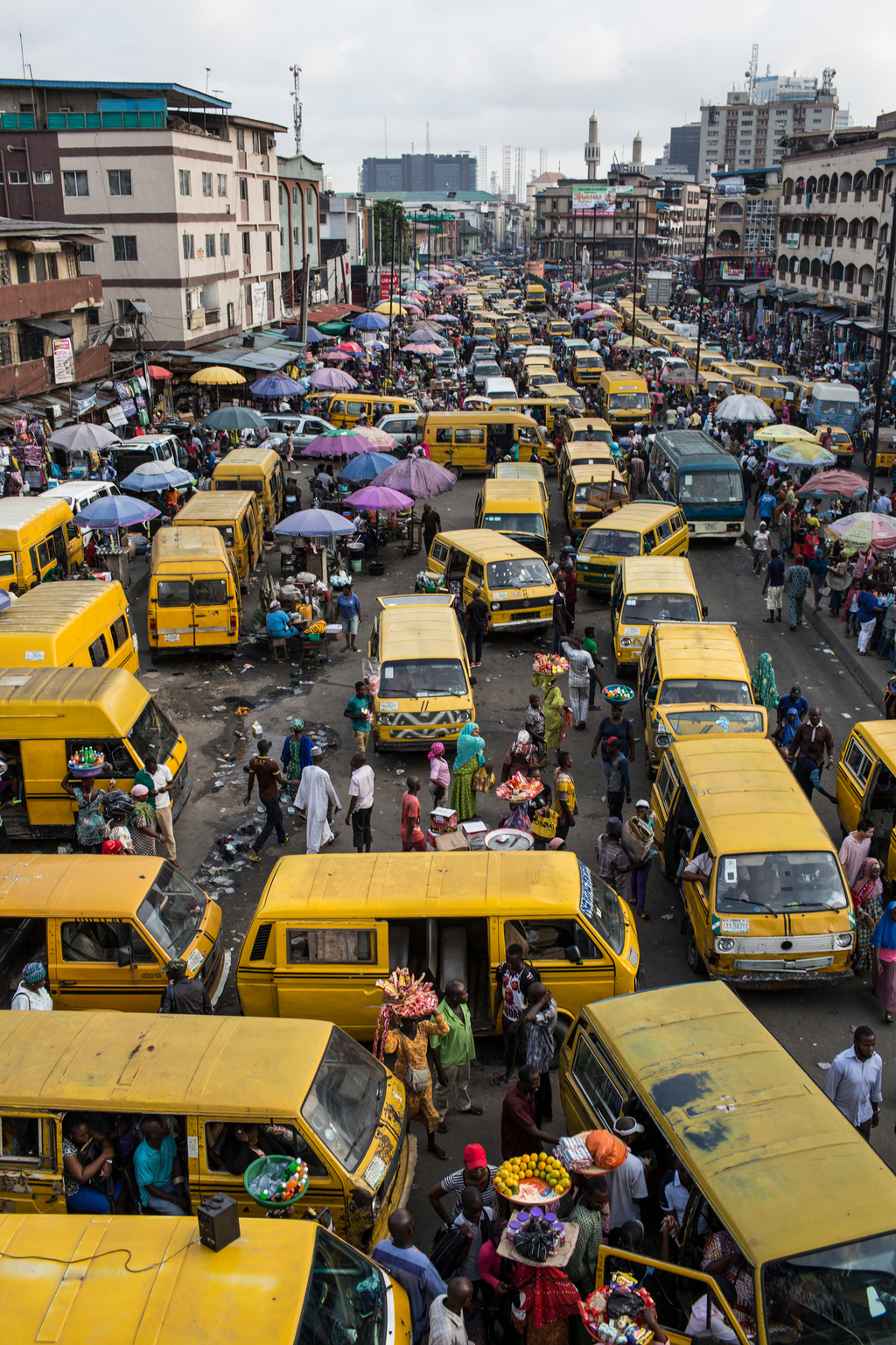 On 27 October 2016 in Lagos, Nigeria, street vendors sell their wares at Oshodi market as commuters make their way home, creating heavy traffic and fumes. Both vendors and commuters complain of headaches and trouble eathing as they inhale the toxic fumes from car exhaust as they are stuck in traffic or on the streets. Almost one in seven of the worlds children, 300 million, live in areas with toxic levels of outdoor air pollution - six times higher than international guidelines according to a report from UNICEF, Clear the Air for Children, released ahead of COP 22. UNICEFs findings, the first of its kind and based on satellite imagery, also show that around 2 billion children in total live in areas where outdoor air pollution exceeds limits set by the World Health Organization as being safe for human health. This air pollution is caused by factors such as vehicle and factory emissions, heavy use of fossil fuels, dust and burning of waste. Indoor pollution is commonly caused by use of fuels like coal and wood for cooking and heating. Taken together, outdoor and indoor air pollution are one of the leading dangers facing children -- they are a contributing factor in the deaths of almost 600,000 children under five every year. This figure represents nearly 1 in 10 under-five deaths. Air pollution is also linked with poor health and diseases among millions more children that can severely affect their overall wellbeing and development. It causes difficulty eathing; studies show it is linked with, and can exacerbate asthma, onchitis, and the inflammation of airways, as well as other underlying health issues. Children who eathe polluted air are at higher risk of potentially severe health problems-- in particular, acute respiratory infections such as pneumonia. Children are more susceptible to the harmful effects of both indoor and outdoor air pollution as their lungs, ains and immune systems are still developing and their respiratory tracks are more