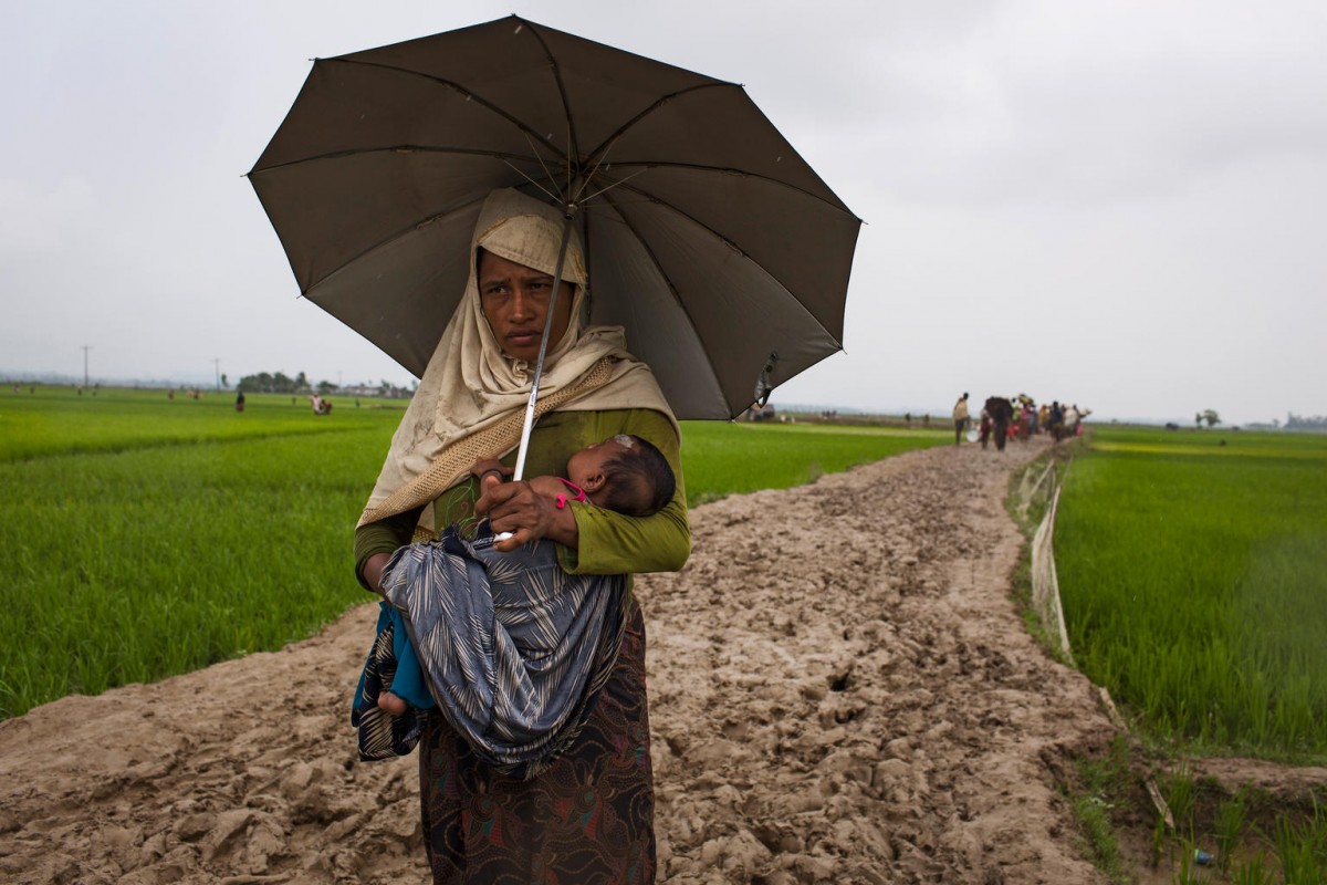 On 6 September 2017, a mother and child who are newly arrived Rohingya refugees from Myanmar walk through paddy fields and flooded land after they fled over the border into Cox's Bazar district, Chittagong Division in Bangladesh.

By 5 September 2017, more than 146,000 Rohingya refugees fled across the border from Rakhine State, Myanmar, into Cox's Bazar district, Chittagong Division in Bangladesh since 25 August. As many as 80 per cent of the new arrivals are women and children. More than 70 000 children need urgent humanitarian assistance. More than 100,000 of the newly arrived refugees are currently residing in makeshift settlements and official refugee camps that are extremely overcrowded while 10,000 newly arrived refugees are in host communities. In addition, 33,000 arrivals are in new spontaneous sites, which are quickly expanding.  While some refugees are making their own shelters, the majority of people are staying in the open, suffering from exhaustion, sickness and hunger. Cox’s Bazar district of Bangladesh is one of the most vulnerable districts, not only for its poor performance in child related indicators but also for its vulnerability to natural hazards.  Most people walked 50 or 60 kilometers for up to six days and are in dire need of food, water and protection. Many children are suffering from cold fever as they are drenched in rain and lack additional clothes. Children and adolescents, especially girls, are vulnerable to trafficking as different child trafficking groups are active in the region. Many more children in need of support and protection remain in the areas of northern Rakhine State that have been wracked by violence.

In Bangladesh, UNICEF is scaling up its response to provide refugee children with protection, nutrition, health, water and sanitation support. With the recent influx of refugees, demand has increased and UNICEF is working to mobilize more support and strengthen its existing activities. For recreational and psychosocial