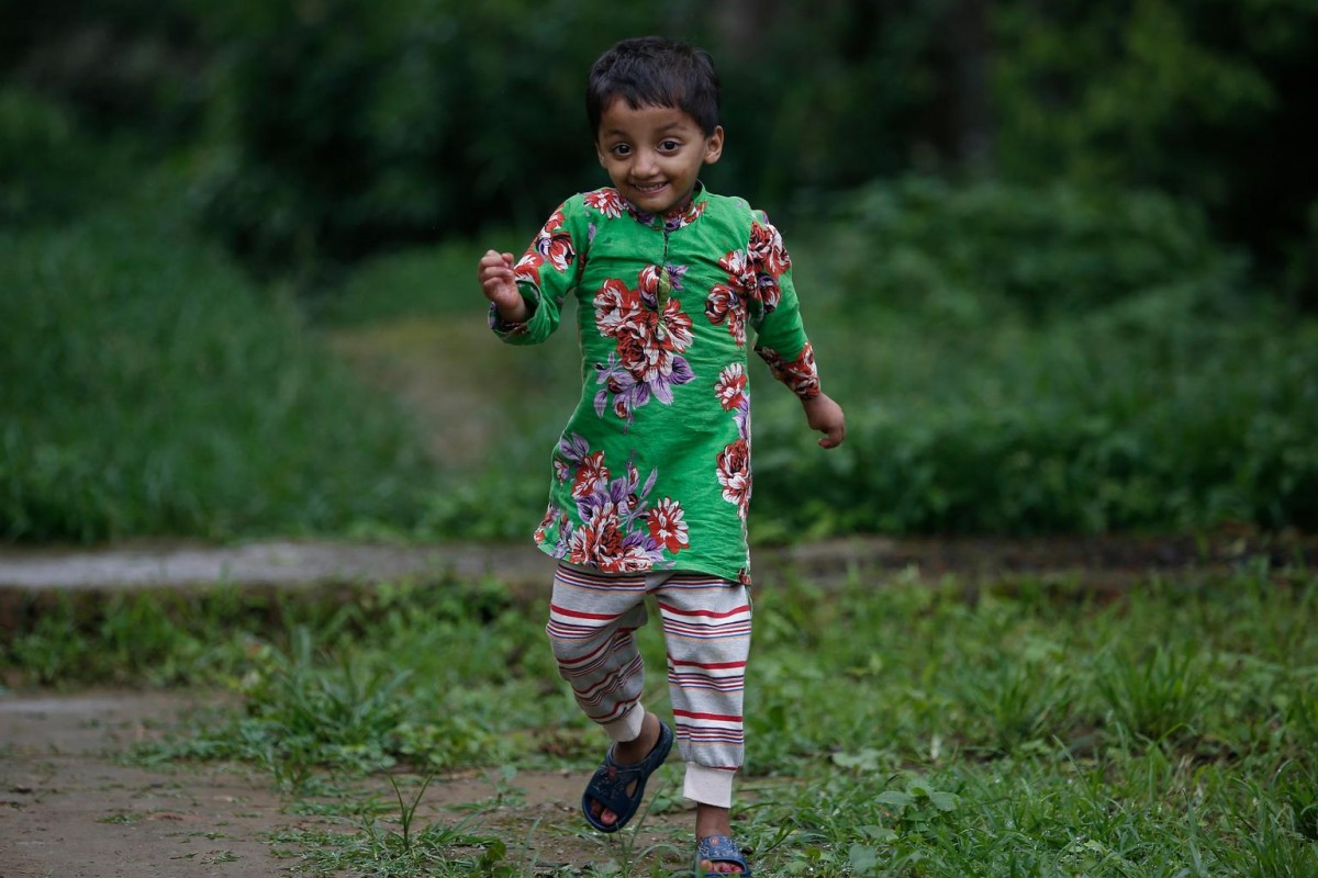 Akriti Banskota, 4, runs happily with her new found energy in Chapagaun village of Lalitpur, one of the 14 most earthquake affected districts in Nepal. Following the earthquake, a UNICEF-supported nutrition program identified Akriti as being severely malnourished and provided Ready to Use Therapeutic Food (RUTF), a peanut-based paste mixed with dried skimmed milk, vitamins and minerals, to improve her nutrition status.