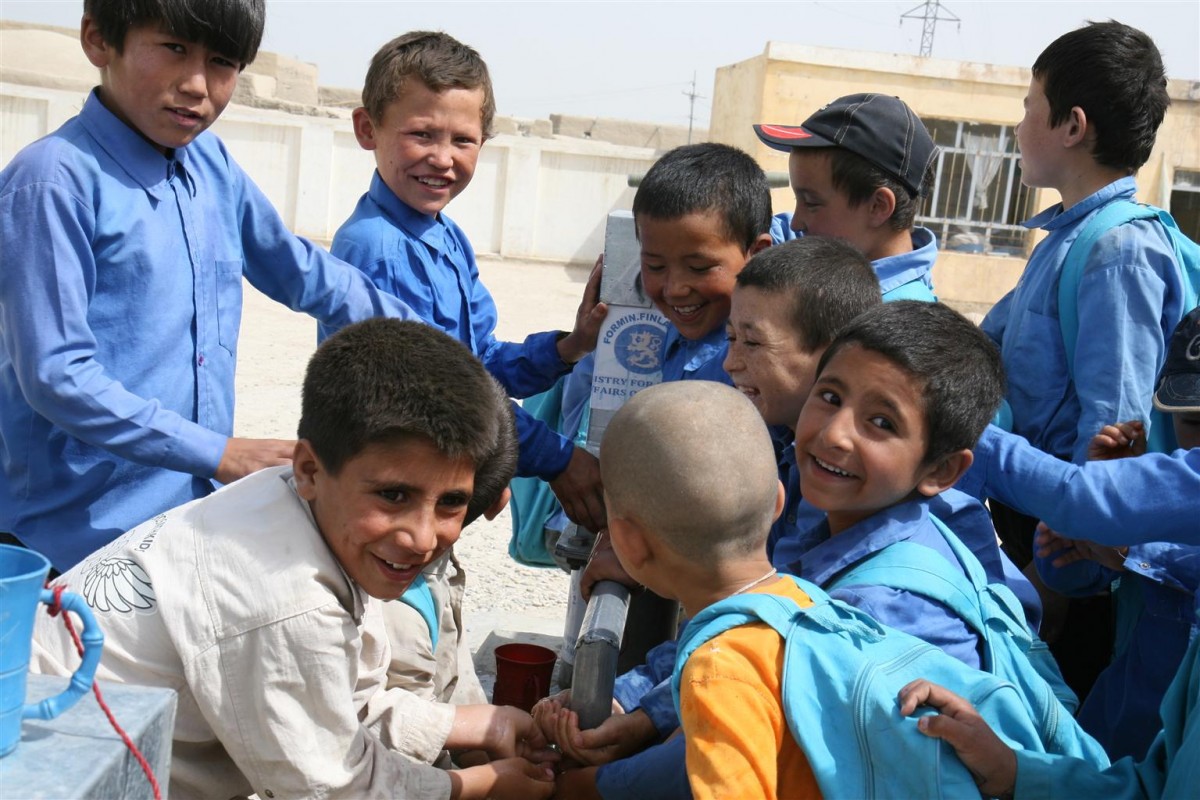 Boys crowd around a hand pump for a drink of water in a school in the city of Mazar, north Afghanistan. The pump is part of a WASH package funded by the Government of Finland, which since 2010 has contributed US$1.33 million to UNICEF for WASH in schools. The new water and sanitation facilities and hygiene education programmes are benefitting almost 77,000 students so far; another 77,000 students are expected to be reached in 2011. Improving water and sanitation in schools and communities is a key area of UNICEF's work in Afghanistan, because of the high impact such improvements have both on health and education, particularly for girls. Only 48 per cent of the population has access to clean water and 37 per cent to sanitation facilities.