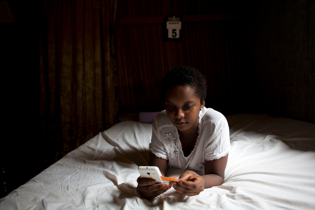 On 23 March 2016, 16-year-old Charmela loads credit to her mobile phone, in her home on the island of Nosy Be, off the northwest coast of Madagascar. The family’s poor financial situation caused her to drop out of school. Too young to work, Charmela spends a lot of time on the Internet and is now being solicited online through messages from men, including pornographic material, through a social media website. A man from Egypt has befriended her and they often communicate through the site, though the two have never met. Charmela enjoys having many virtual friends and frequently adds strangers to the list of people with whom she maintains contact. Her vulnerability puts her at high risk of sexual exploitation. The Internet is used by adults who seek children to sexually exploit them.

Madagascar is one of the poorest countries in the world with 91 per cent of the country’s 21 million people living on less than US $2 per day. Almost 50 per cent of the population is under the age of 18, and 40 per cent are under age 15. While measures have been taken to protect children since Madagascar signed the Convention on the Rights of the Child in 1991, political instability, extreme poverty and socio-economic crises continue to be cause for concern. After a prolonged period of isolation following the 2009 coup d’état, Madagascar has begun a period of gradual return to stability since the formation of a new government in April 2014. Despite a return to international legitimacy, the country exhibits signs of fragility, including weak infrastructures and severely compromised social services. Sexual exploitation of children is widespread, including in travel and tourism in some areas of the country. In 2012, 14 per cent of girls aged 15-19 were victims of sexual violence and 15 per cent were victims of physical violence. Social media platforms, where children and adolescents face online solicitation and grooming for sexual exploitation, are easily accessible through inexpen