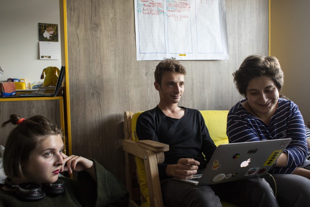 ©UNICEF/Ukraine/2018/Vlasova Yana Panfilova (R) with colleagues at the Teenergizer office in Kyiv, Ukraine. Teenergizer is an organization which works with both HIV positive and non-positive teenagers, and provides sex education and HIV transmission awareness for youth.