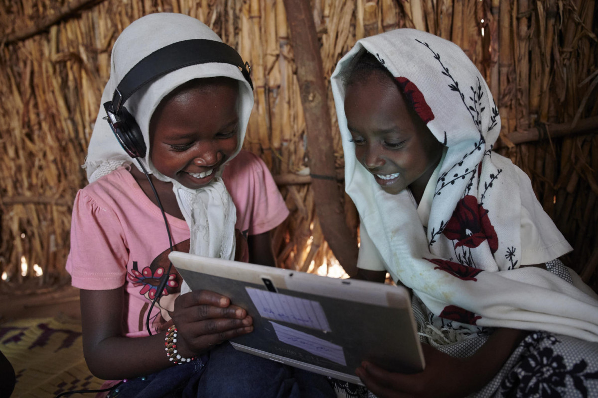 Children use their tablet and work with each other at the UNICEF-supported Debate e-Learning Centre in a village on the outskirts of Kassala, the capital of the state of Kassala in Eastern Sudan.