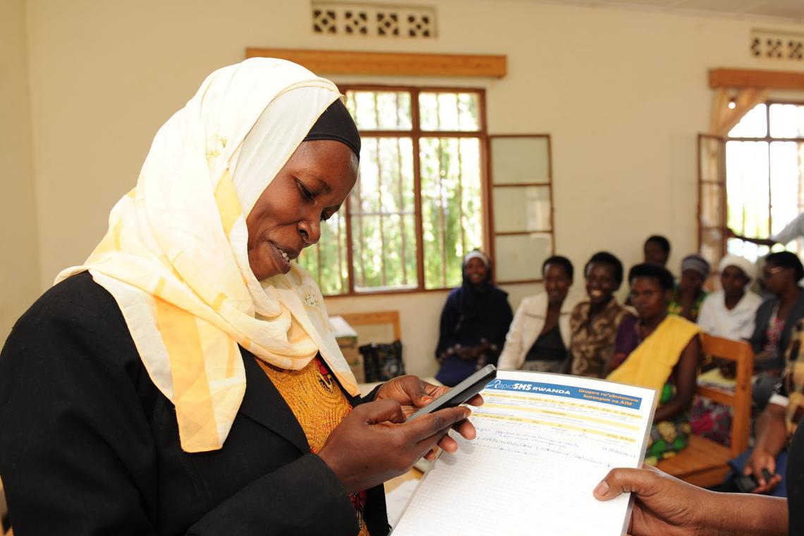 ©UNICEF Rwanda/2017/Nkinzingabo A community health worker uses RapidSMS to log data about new and expecting mothers in a local health centre.