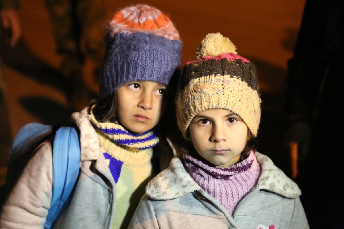 On 11 January 2016 in Madaya, Rural Damascus, children and their families wait for permissions to leave the besieged town.UNICEF, as part of a UN, ICRC and Syrian Arab Red Crescent convoy to Madaya, Rural Damascus, delivered therapeutic and other nutrition supplies that included multiple micronutrients, high energy biscuits, therapeutic food and medication for the treatment of severe and acute malnutrition.