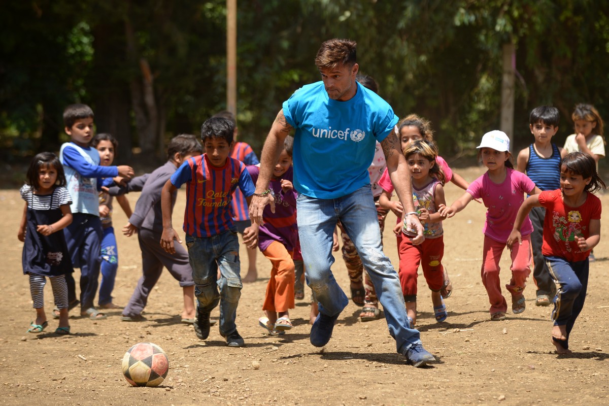 On 1 June 2016, UNICEF goodwill ambassador Ricky Martin plays football with Syrian refugee children at Al-Hissa informal refugee settlement in northern Lebanon.

World-renowned singer and UNICEF Goodwill Ambassador Ricky Martin calls for increased focus on safeguarding the futures of millions of children affected by the Syria conflict, whose lives have been shaped by displacement, violence and a persistent lack of opportunities. During the two-day visit to Lebanon from 1-2 June 2016, Martin also witnessed how UNICEF is working to provide protective environments for children and adolescents where they can play and receive the support they need to get back into formal education. In Lebanons Bekaa valley and Akkar, Martin participated in recreational activities for children at safe spaces in informal settlements. Additionally, he met adolescents attending life-skills training, provided by UNICEF and partners, where girls and boys are given vocational training and learning support.

Around 1.1 million Syrians have sought refuge in Lebanon since the start of the crisis in 2011, more than half of them are children. Child refugees are particularly at risk of exploitation and abuse, with large numbers being left with no choice but to go out to work, rather than attend school. Child refugees are particularly at risk of exploitation and abuse, with large numbers being left with no choice but to go out to work, rather than attend school.  The deteriorating economic situation for Syrian refugees has dramatically exacerbated the problem of child labour in Lebanon. Adding to the psychological distress already affecting many of the children who have fled conflict and violence at home is the challenge associated with some of the worst forms child labour such as working on construction sites, which can cause long-term developmental and psychological damage as well as physical harm. UNICEF is working closely with the Government institutions, as well as local and international part