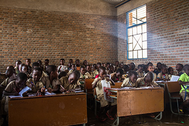 © UNICEF Burundi/2016/Haro Aimable at class in his primary school. As a new student, he is catching up on the education he missed while living on the streets.