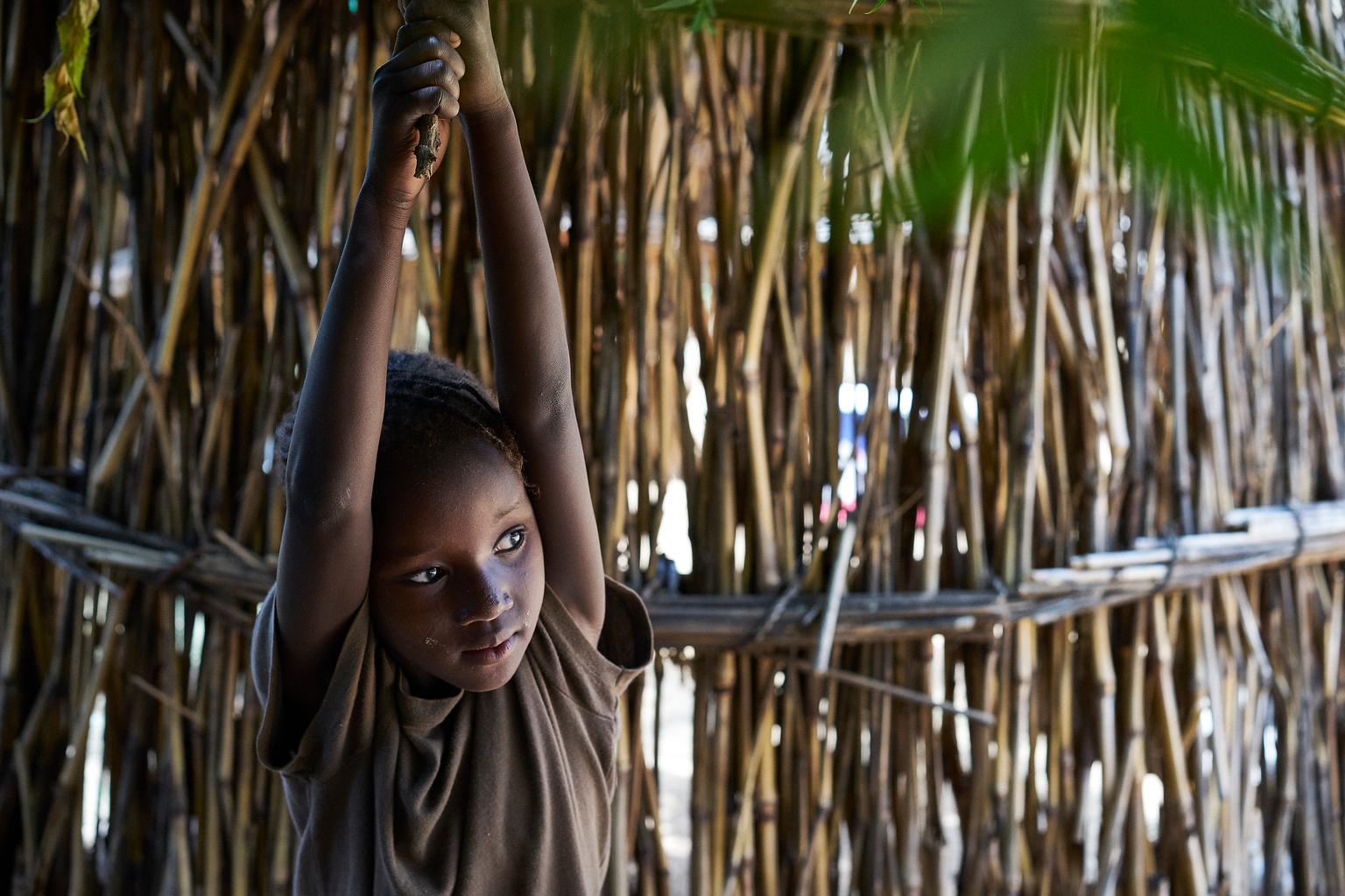 Mahazouna, 6 years old, daughter of Rahoua Bounya, 30 years old in the village of Kadazaki, Matameye department, Niger on August 14, 2016. Rahoua's husband left her more than 5 years ago to find work in Libya. She has 6 children and 4 still live with her, three boys and a girl. The two older daughters, 15 and 13 years old are already married.The older girls were not good at school and the teacher was beating them so they dropped out. The other of my husband decided to marry them because they could not just stay here and do nothing. Now I have less children to feed, its better for us. Rahoua cultivates her husbands lands and with the harvest, they can eat for 3 to 4 months. But it isnt enough. My boys are growing fast and I need money for the future lands they will need to survive on. I heard about women who had been to Algeria to beg who had become rich. I was envious. So I left in July. I was lucky because I reached Algeria in 4 days. I used all my savings and had to borrow 50,000 franc to reach Tamanrasset. Rahoua left with her two youngest children and left the others to the surveillance of their uncle. The desert was scary, I know a lot of people die out there. When I arrived two people from the village were waiting for us and they took us to a house were we stayed. In the morning, we would leave and go begging.
