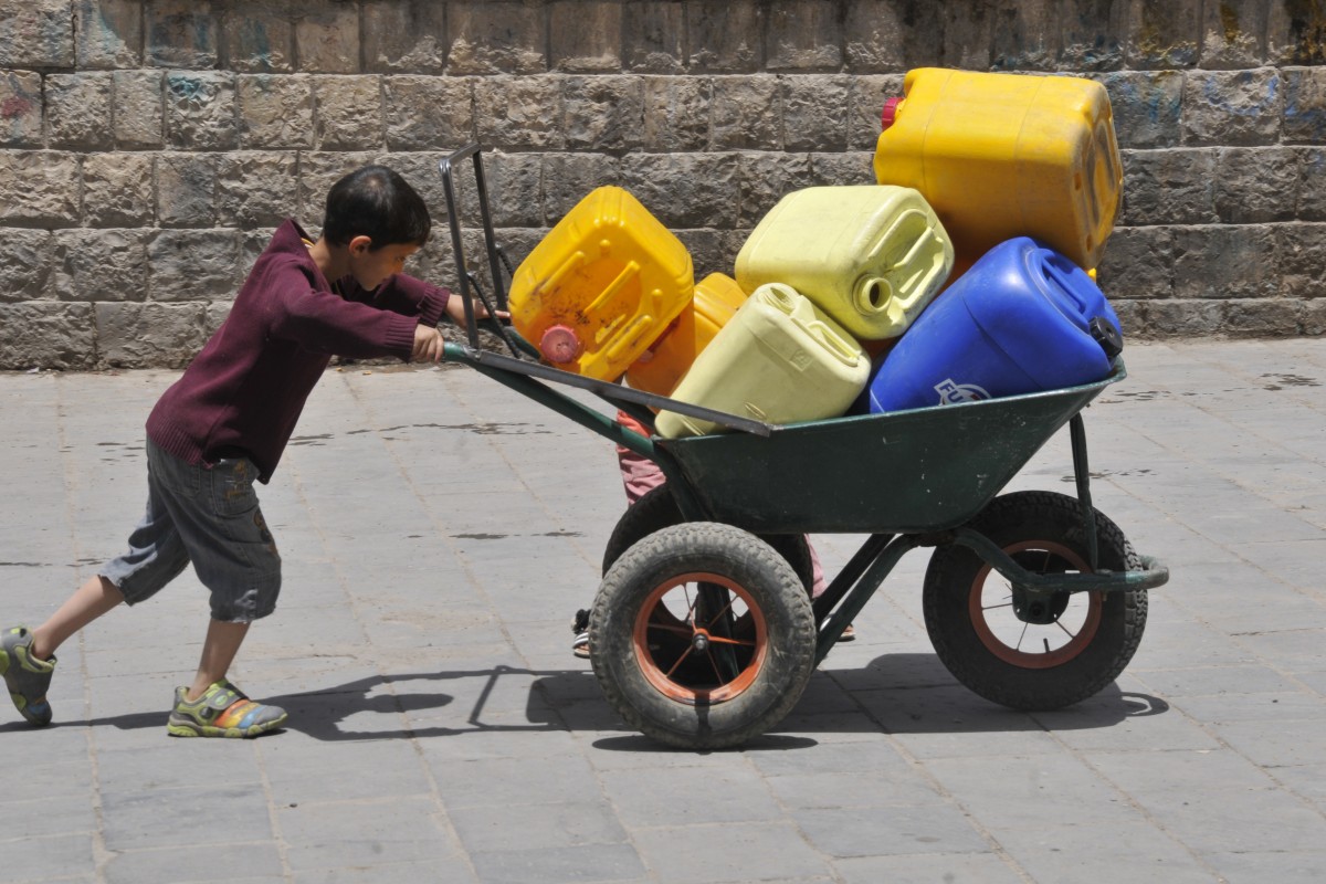On 11 May, a boy pushes a wheelbarrow filled with jerrycans in Sanaa, the capital.

By 12 May 2015 in Yemen, escalating conflict continued to exact a heavy toll on children and their families. Some 300,000 people have been internally displaced. Casualties have reached 1,527, including 115 children, and 6,266 people have been injured, including 172 children. Prior to the current crisis, 15.9 million people  including 7.9 million children  were already in need of humanitarian assistance. Despite the challenging operating conditions, UNICEF is scaling up its humanitarian response, including in the areas of nutrition, water, sanitation and hygiene (WASH), health, child protection and education. Support since the start of the current conflict has included providing access to clean water to 604,360 people and access to antenatal, delivery and postnatal care to 3,386 pregnant women; distributing hygiene kits to 16,662 families; and sharing educational messaging on health, hygiene and protection to 38,000 people. UNICEF has appealed for US$88.1 million to cover these and other responses through December 2015; 87 per cent remains unfunded to date.