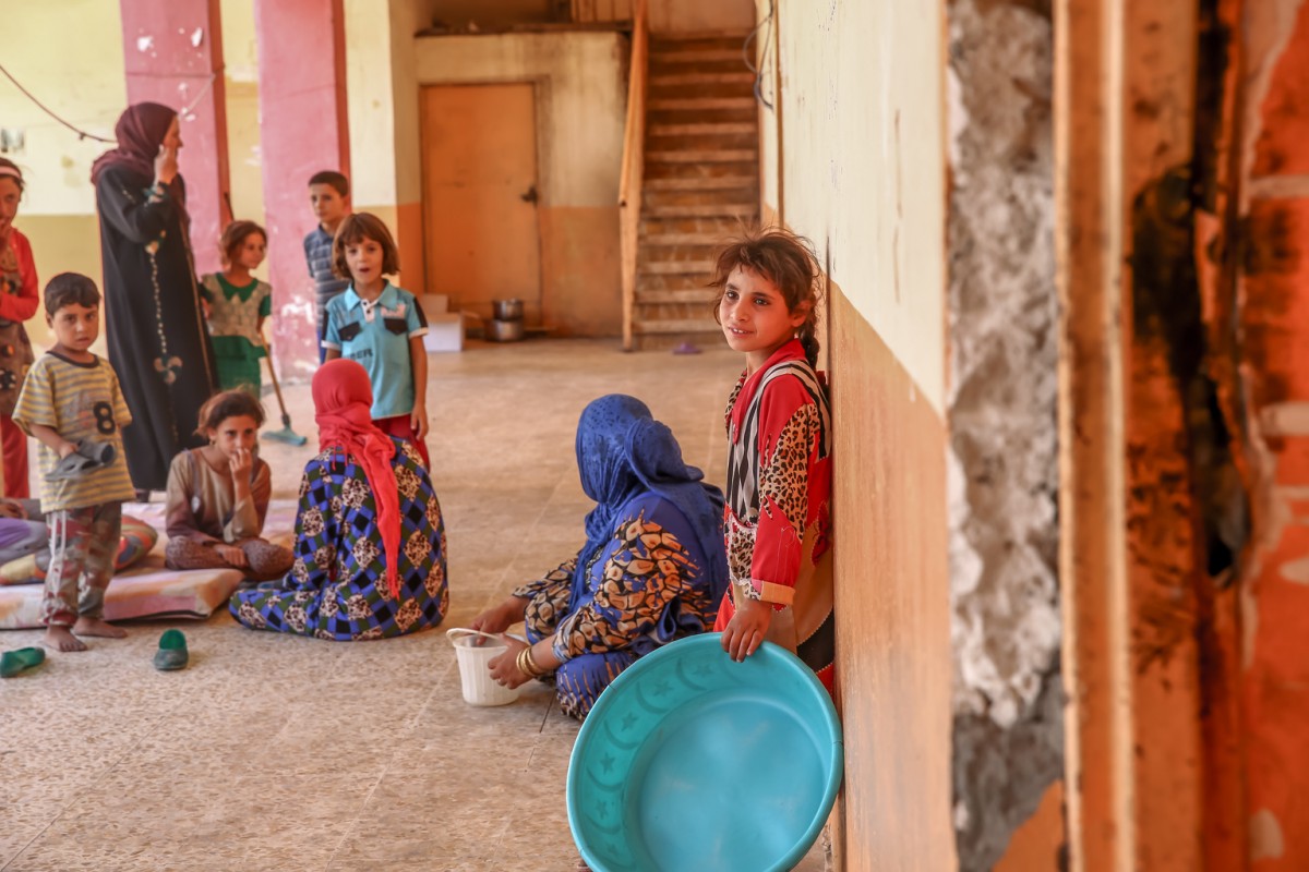 Women and children sit in the hallways of a school building being used as a shelter for displaced families in the village of Haji Ali in Ninewa governorate. 

One in five schools in Iraq are currently out of use, putting additional strain on an already overburdened education system. UNICEF estimates that 3.5 million school-aged children do not have access to education, increasing their vulnerability to abuse and exploitation.

As of 21 September, 108 families were living Tinah Camp, a transitional displacement camp in Tinah village near the town of Qayyarah in Ninewa Governorate. The camp is located in a newly-retaken area with no basic services. In early September UNICEF began providing safe water to the camp to help children cope with the harsh environment. 

A military operation to retake Mosul and surrounding areas from the so-called Islamic State/Daesh is underway, with military forces within 60 kilometres of the city.

Since March 2016, more than 160,000 people have been displaced from Mosul, Shirqat, Qayyarah, and surrounding areas. The UN estimates that by of end of the year, up to one million people from Mosul may flee their homes. 

In the coming months, UNICEF aims to assist up to 784,000 people displaced by conflict in and around Mosul, nearly half of them children.

More than 3.3 million people have been displaced by conflict in Iraq since early 2014.